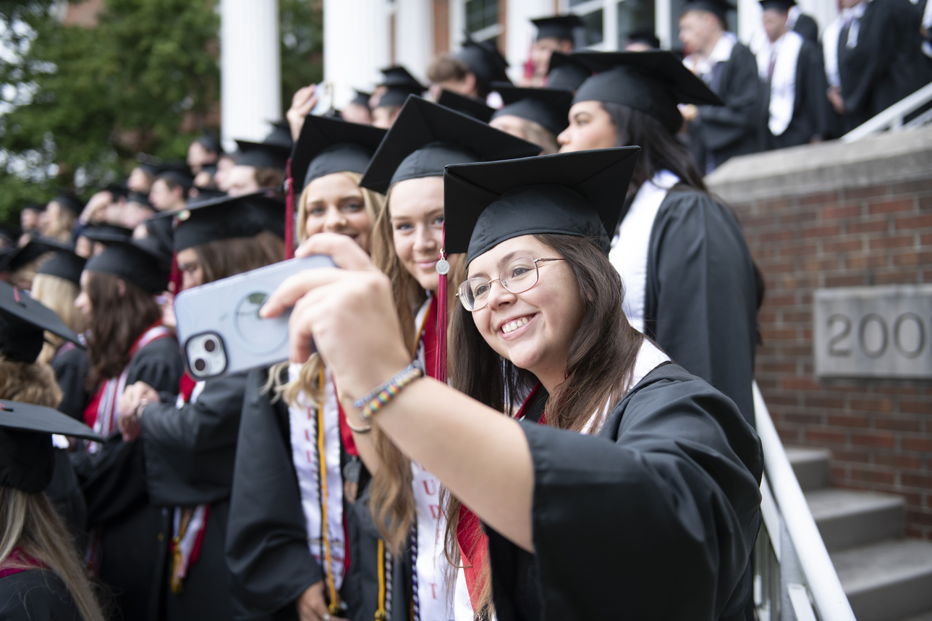 Students taking selfie at graduation